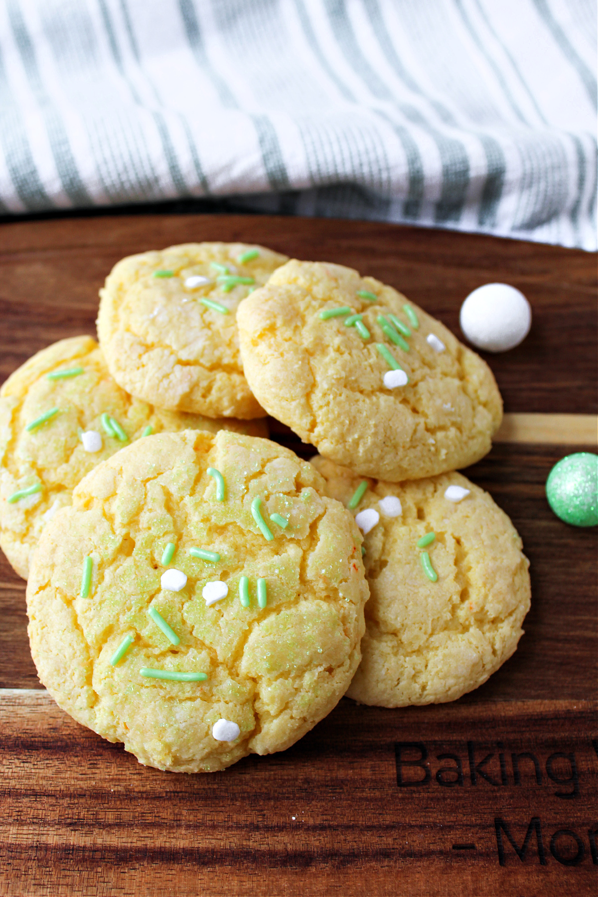 Gooey butter st patrick cookies on a brown wooden board. 