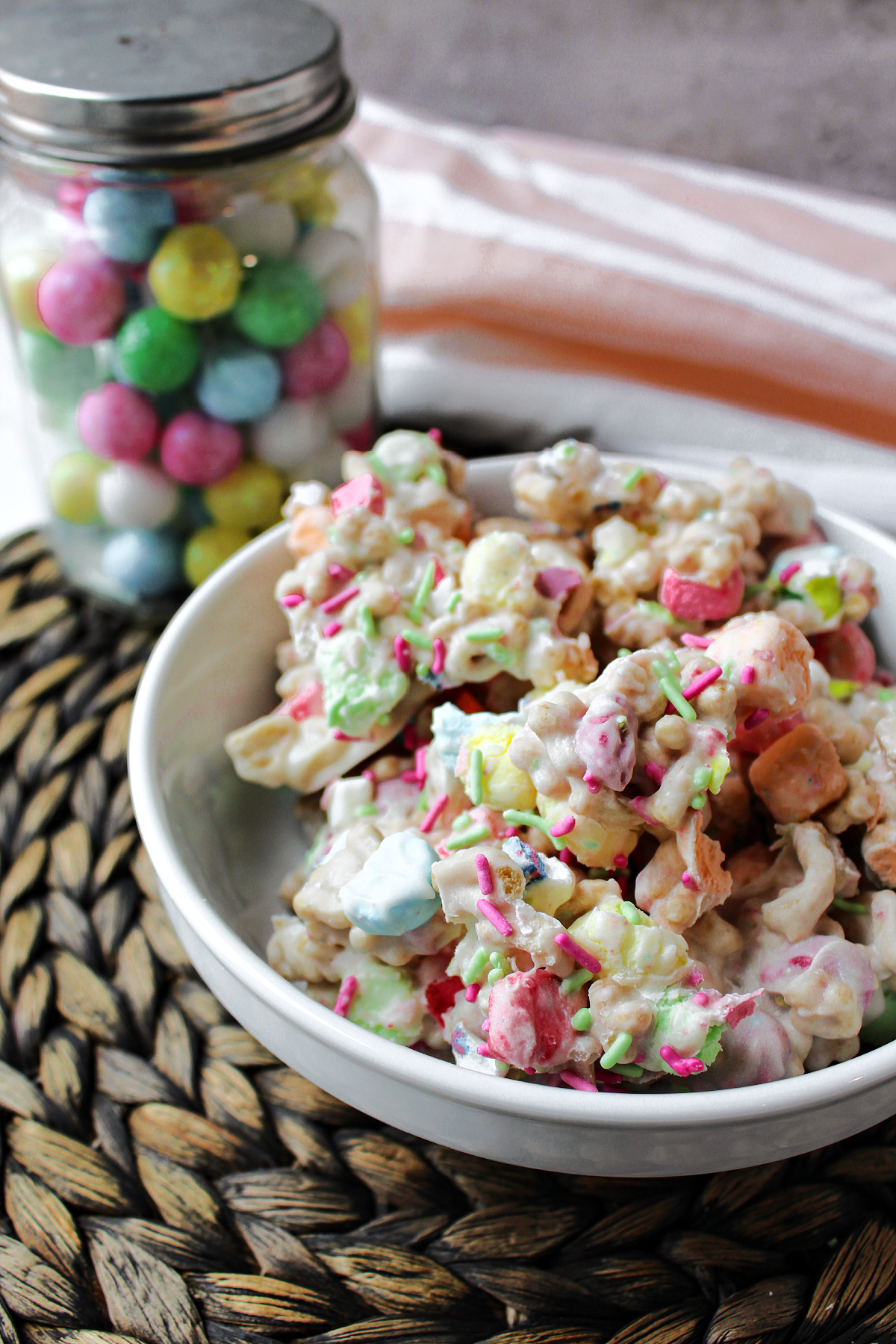 Easter marshmallow candy on a brown mat with a towel. 