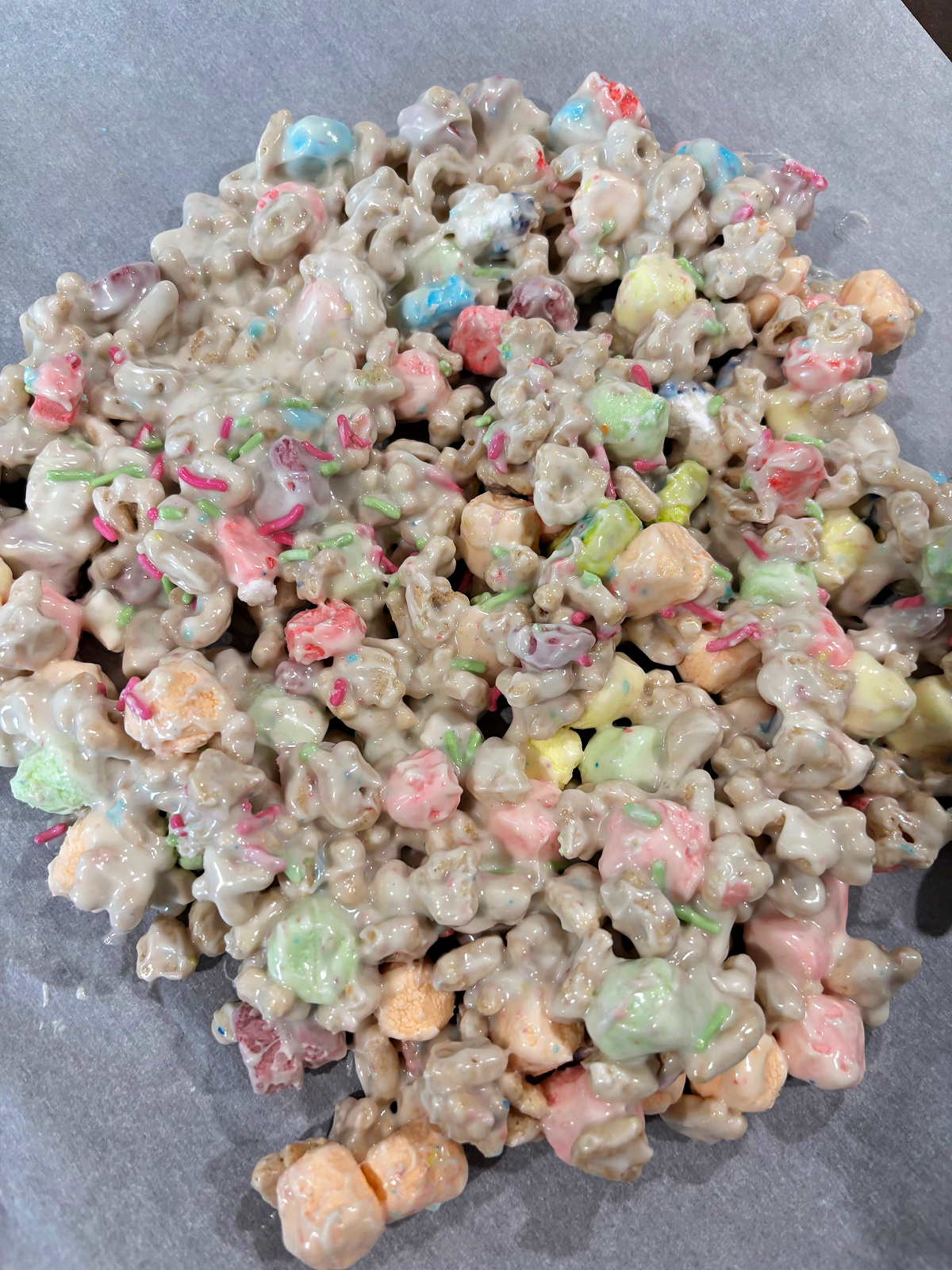 Easter candy spread on parchment paper to dry.