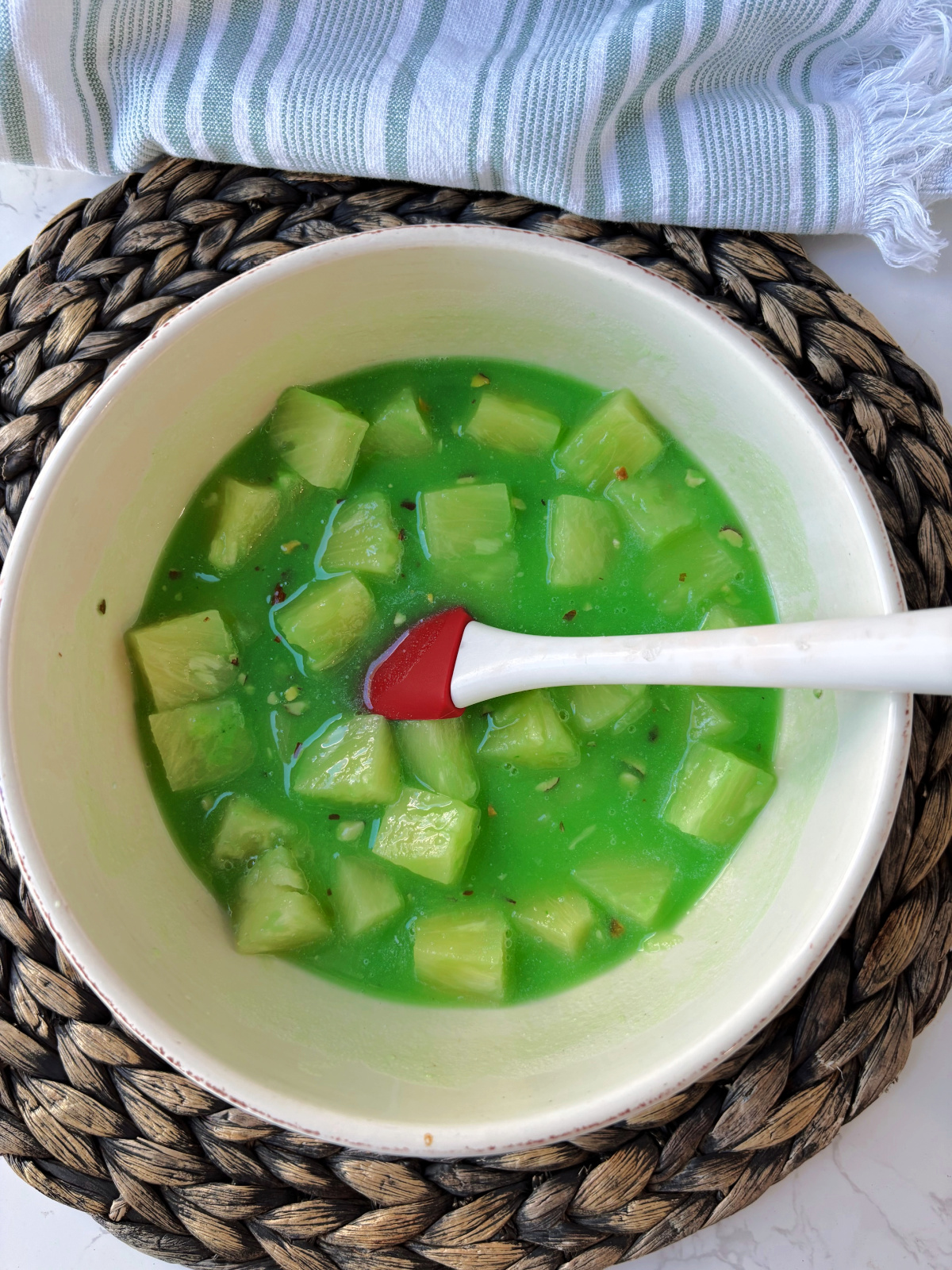 pineapple in pudding mix in a cream bowl.
