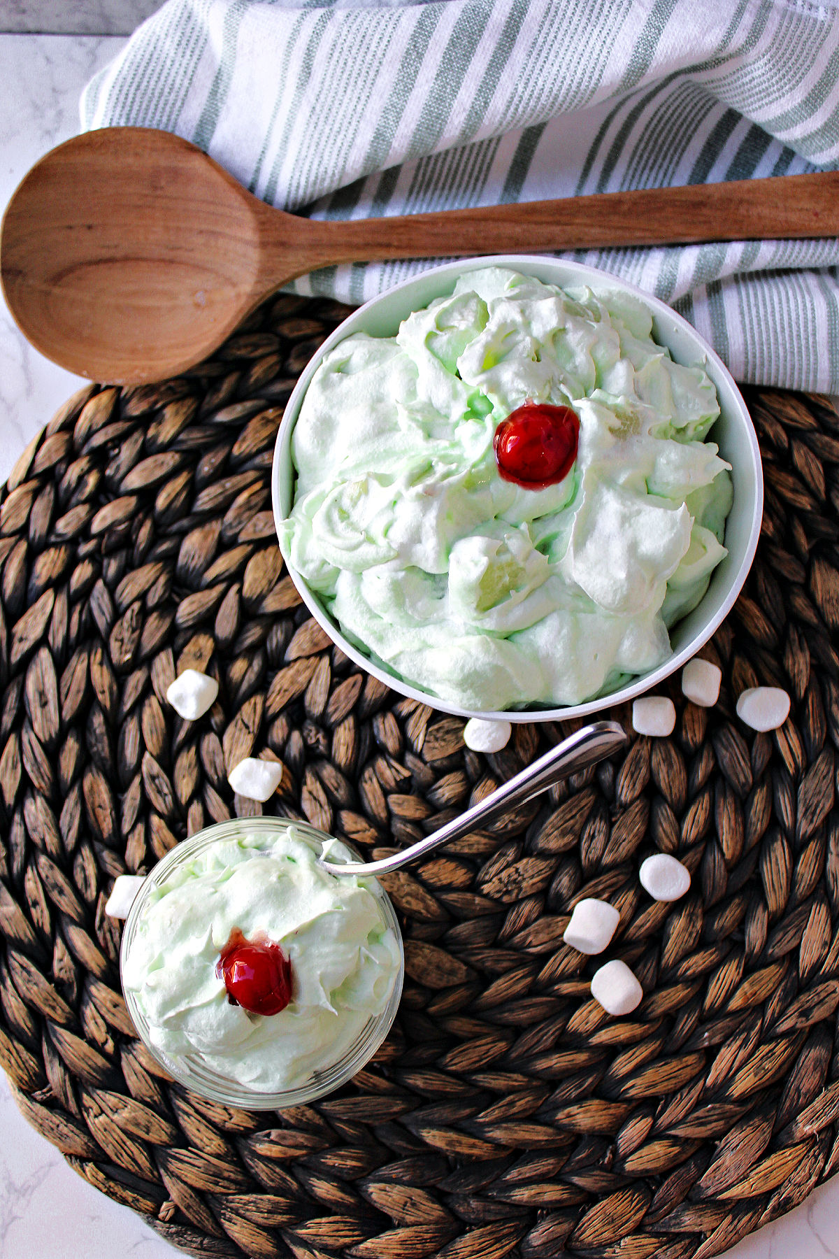watergate salad on a brown mat in a clear bowl.