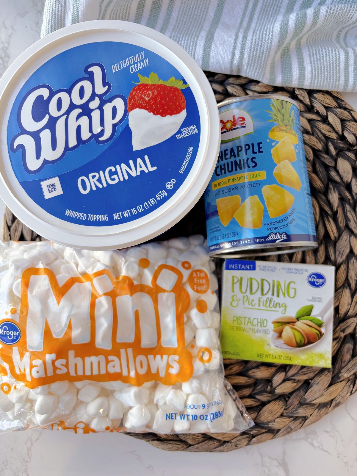 watergate salad ingredients, Cool Whip, pineapple, pudding and marshmallows.