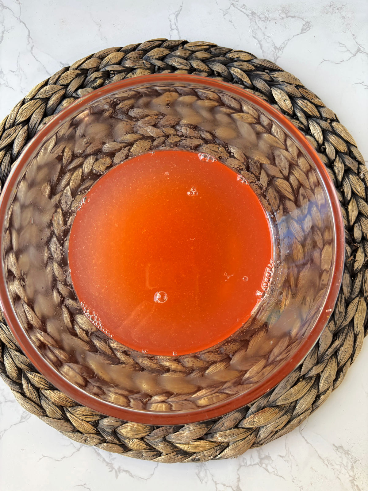 peach gelatin in a clear bowl.