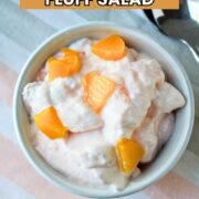 Peach Lemonade Fluff Salad in a white bowl on a colored towel.
