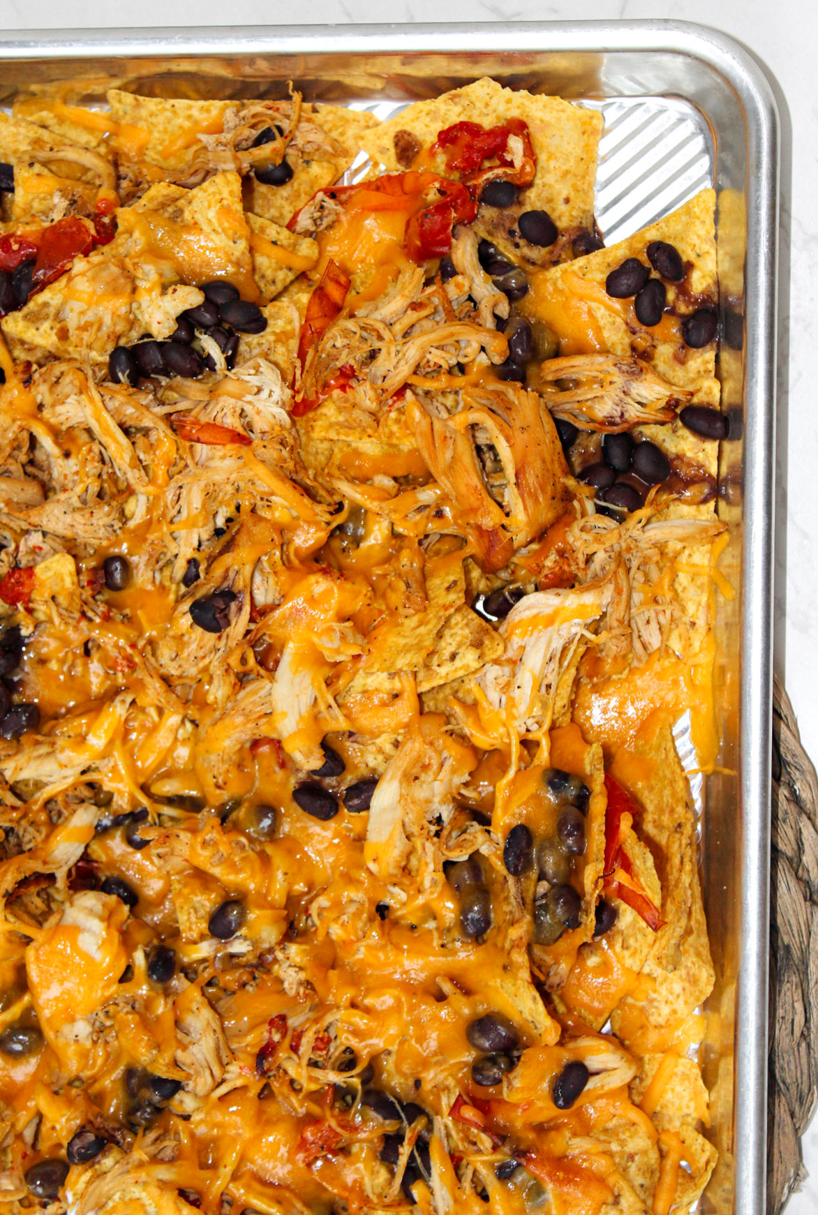 sheet pan fajita nachos with black beans.