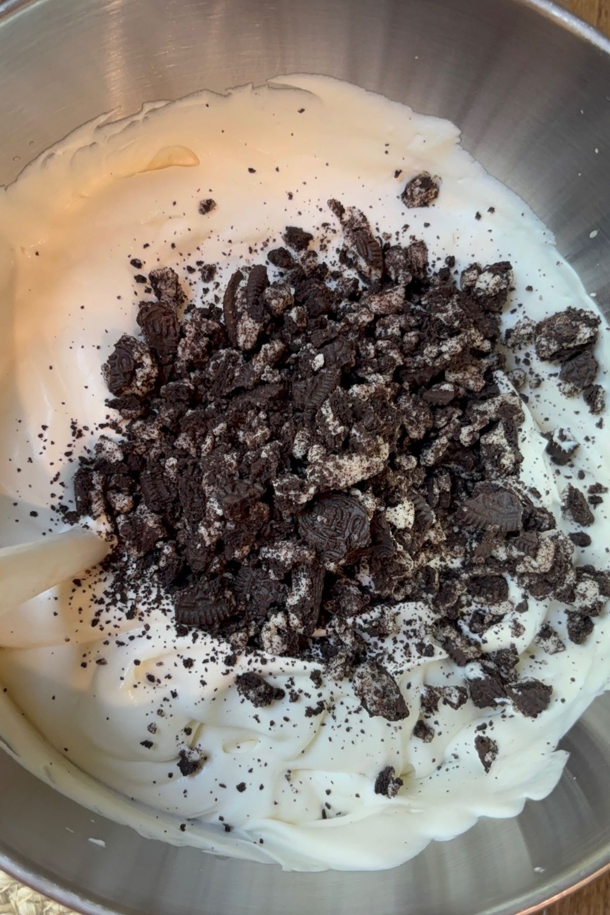 Oreo cookies crushed in the ice cream bowl.
