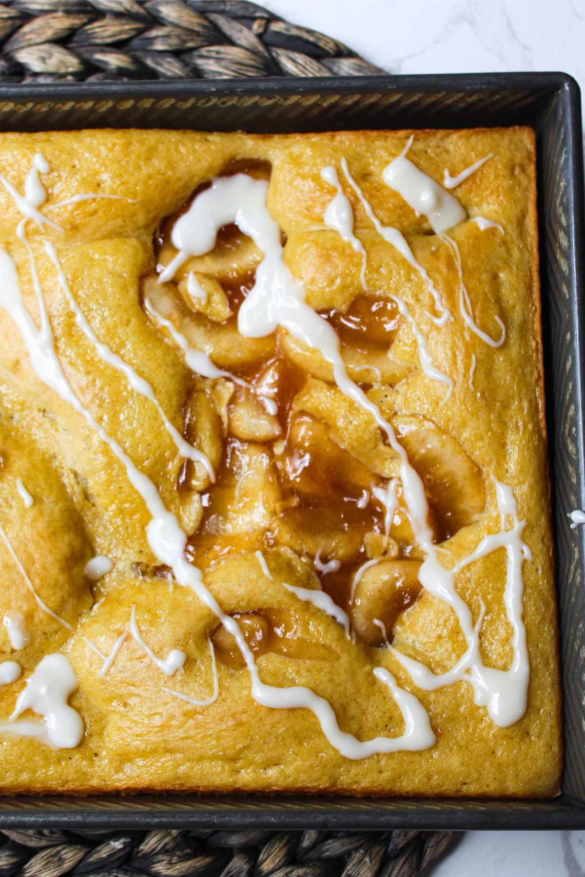 baked apple pie cake in a pan.