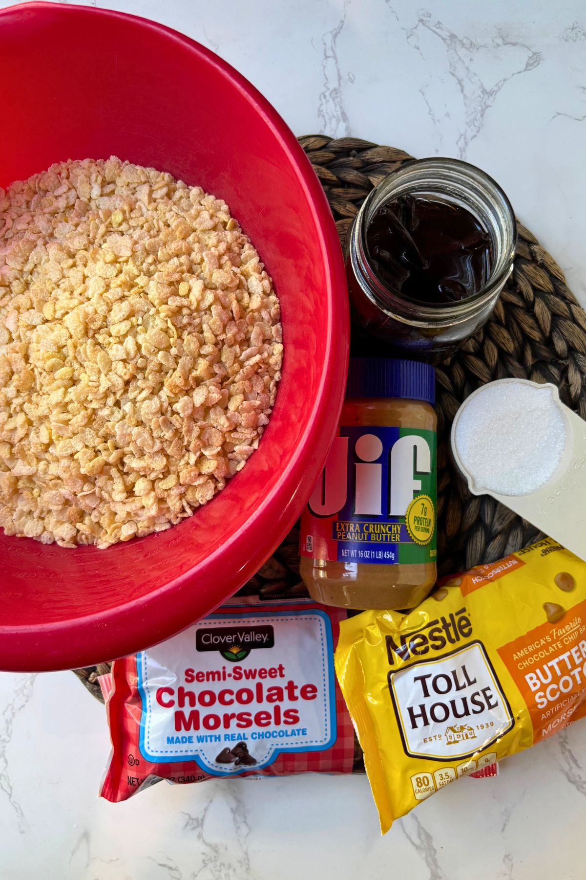 scotcheroos ingredients of chocolate chips, rice krispies and peanut butter.