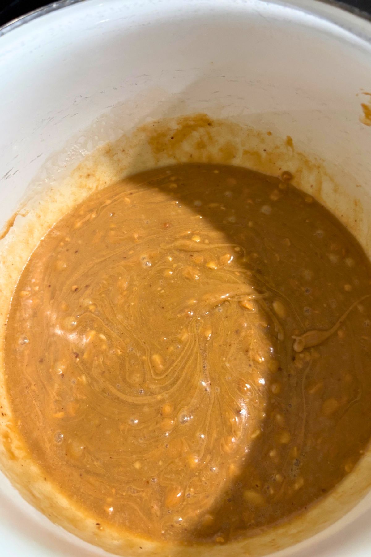 melted peanut butter in a pot.