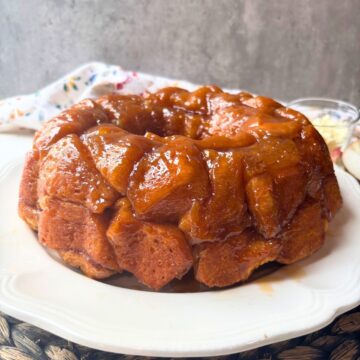 apple monkey bread on a white plate.