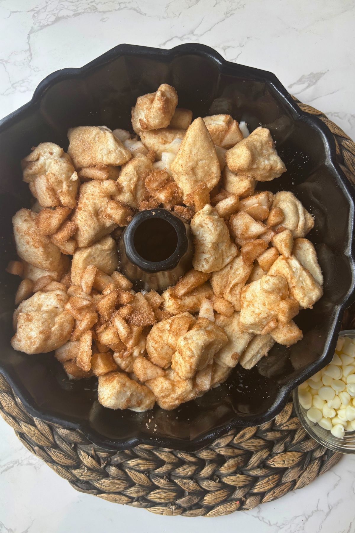 A bundt pan with dough in it.